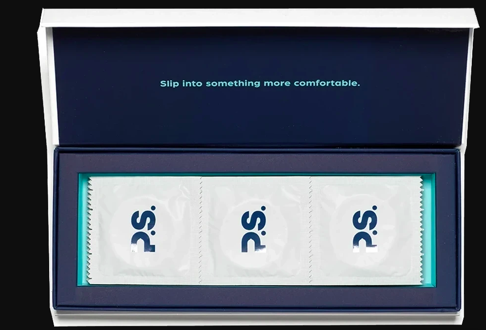 Box of three white condom wrappers that say &quot;P.S.&quot; on the front in a black box