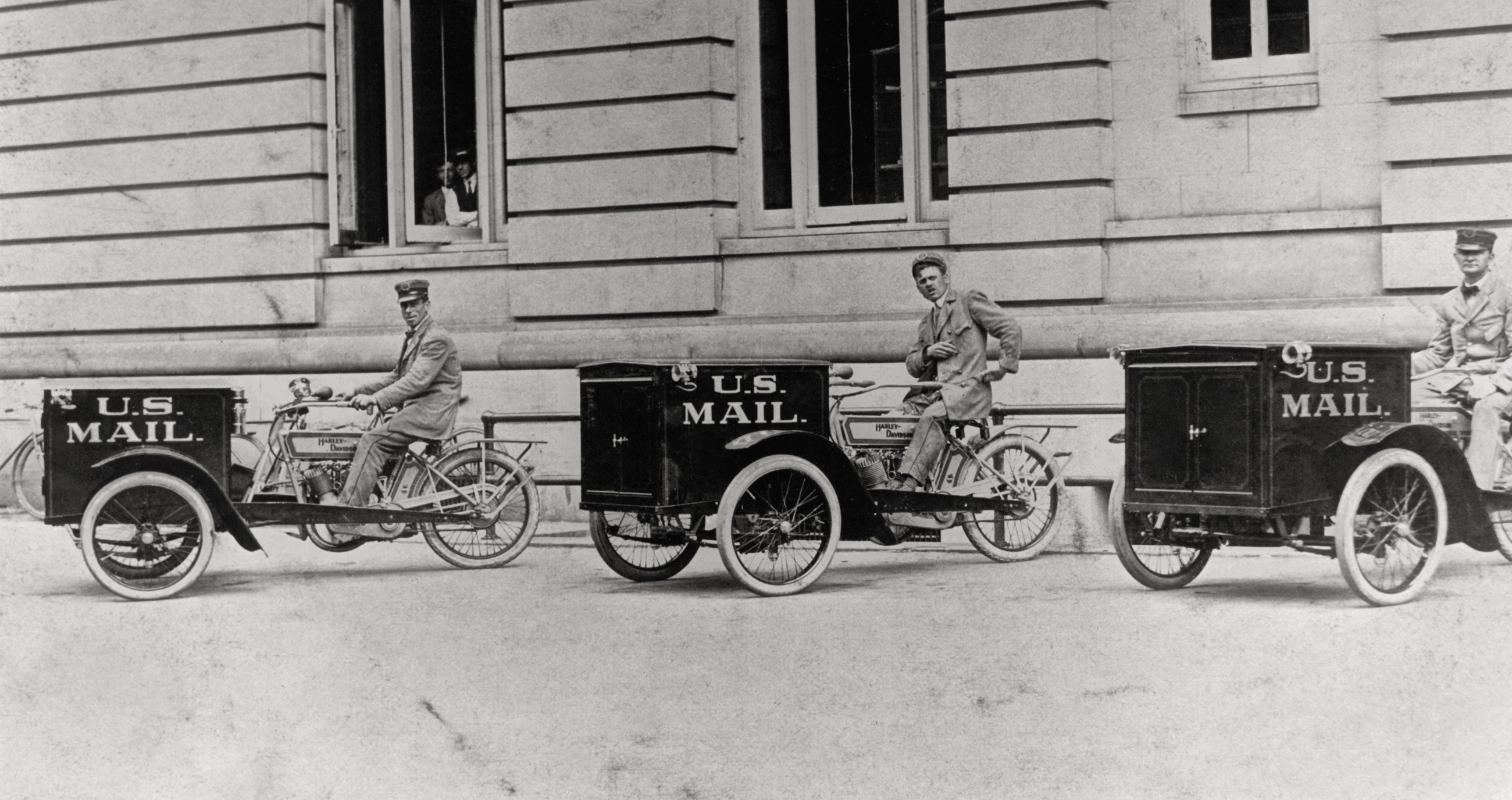 Three men on small motorcars that say US mail