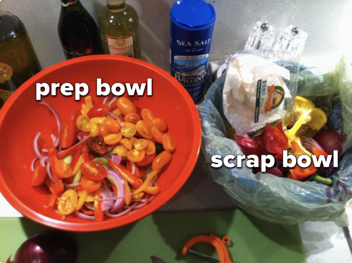 A countertop prep space with a &#x27;prep bowl&#x27; and a &#x27;scrap bowl&#x27; labeled