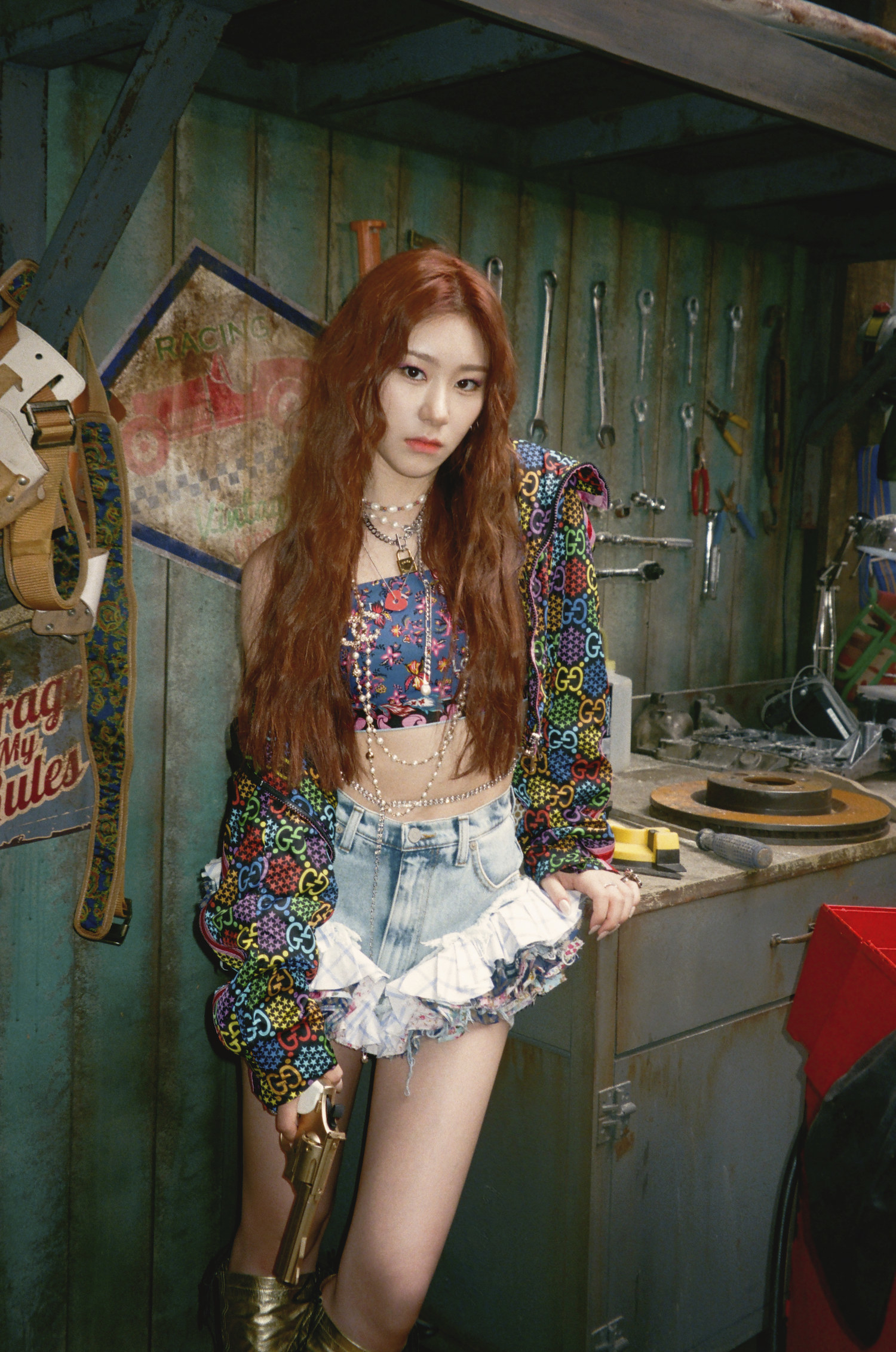 Chaeryeong wears multiple layered necklaces alongside a tube top and ruffled shorts