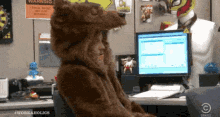 Blake spinning around his desk chair, in a bear costume, saying &quot;fur sure.&quot; 