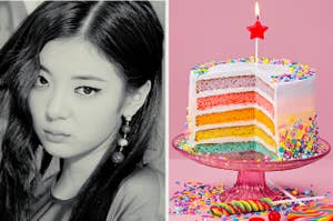Lia poses next to a rainbow colored cake with candy on top
