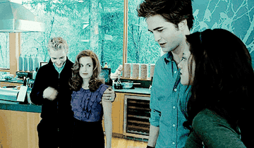 Carlisle, Esme, Edward and Bella in the Cullen kitchen laughing