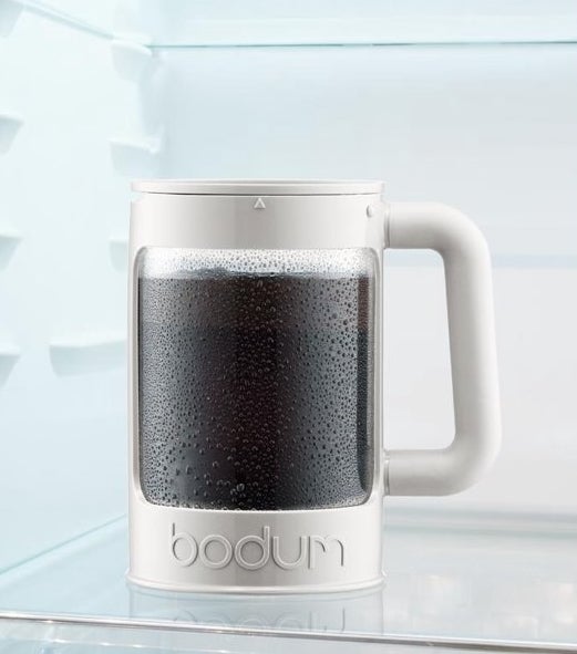 Product photo showing Bodum cold brew maker in white filled with fresh cold-brewed coffee