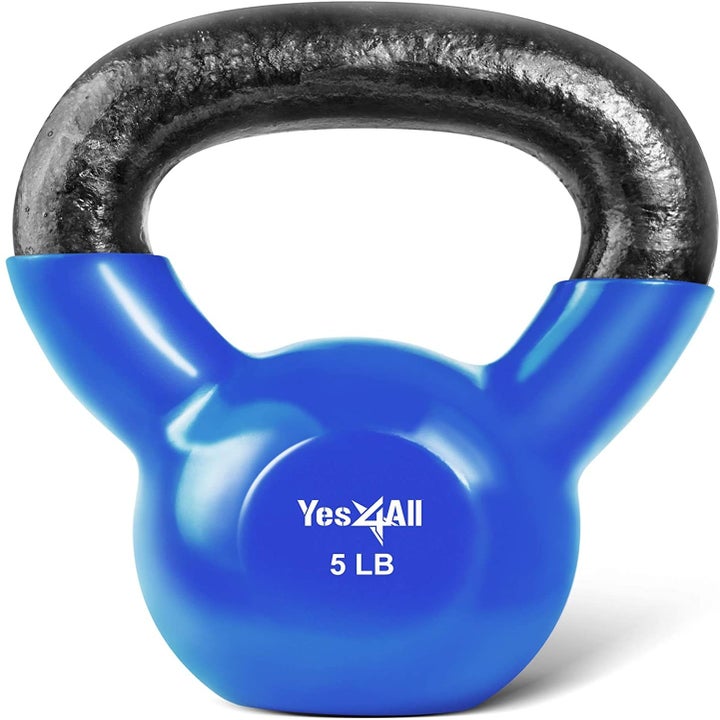 A five pound kettle bell with a blue vinyl coating over the ball that stops before the grip