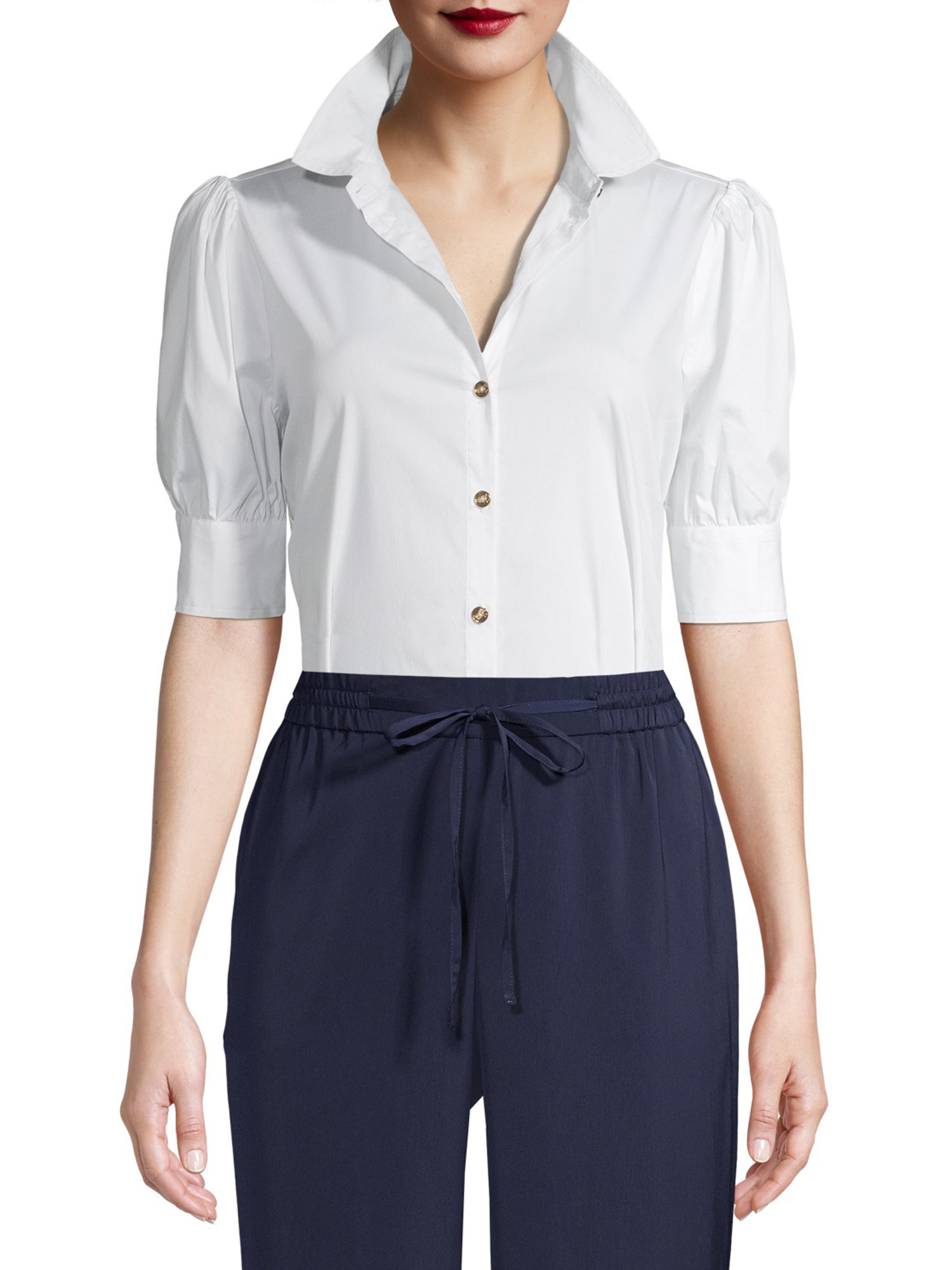 Model wearing a white, short-sleeve, button-down shirt with the collar up