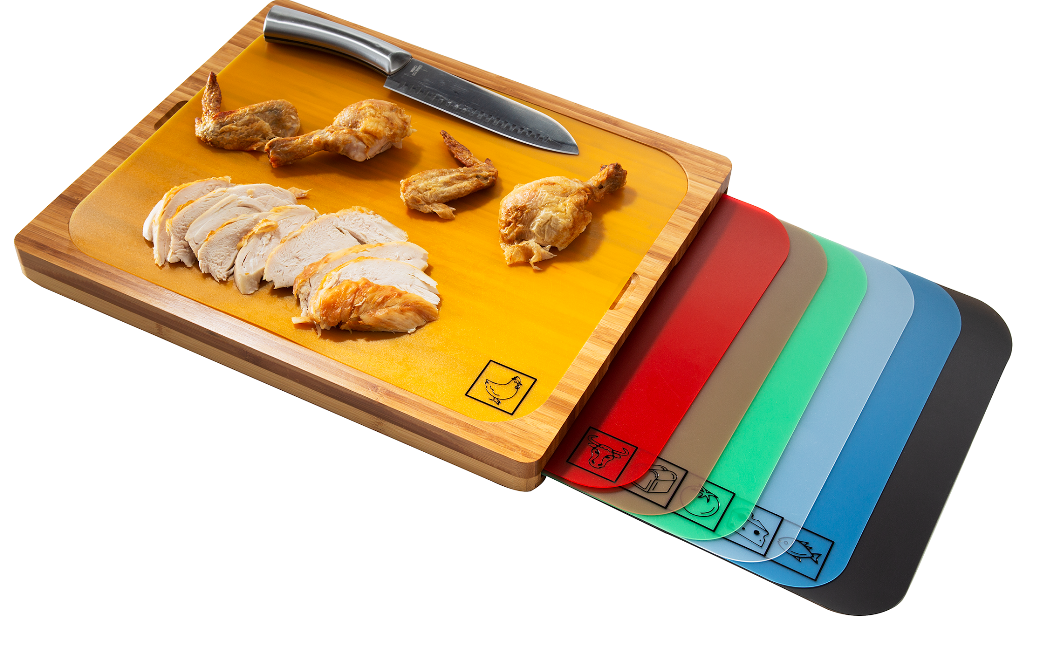 Product photo showing bamboo cutting board with 7 color-coded cutting mats, with the poultry mat being used on the bamboo cutting board to slice chicken 