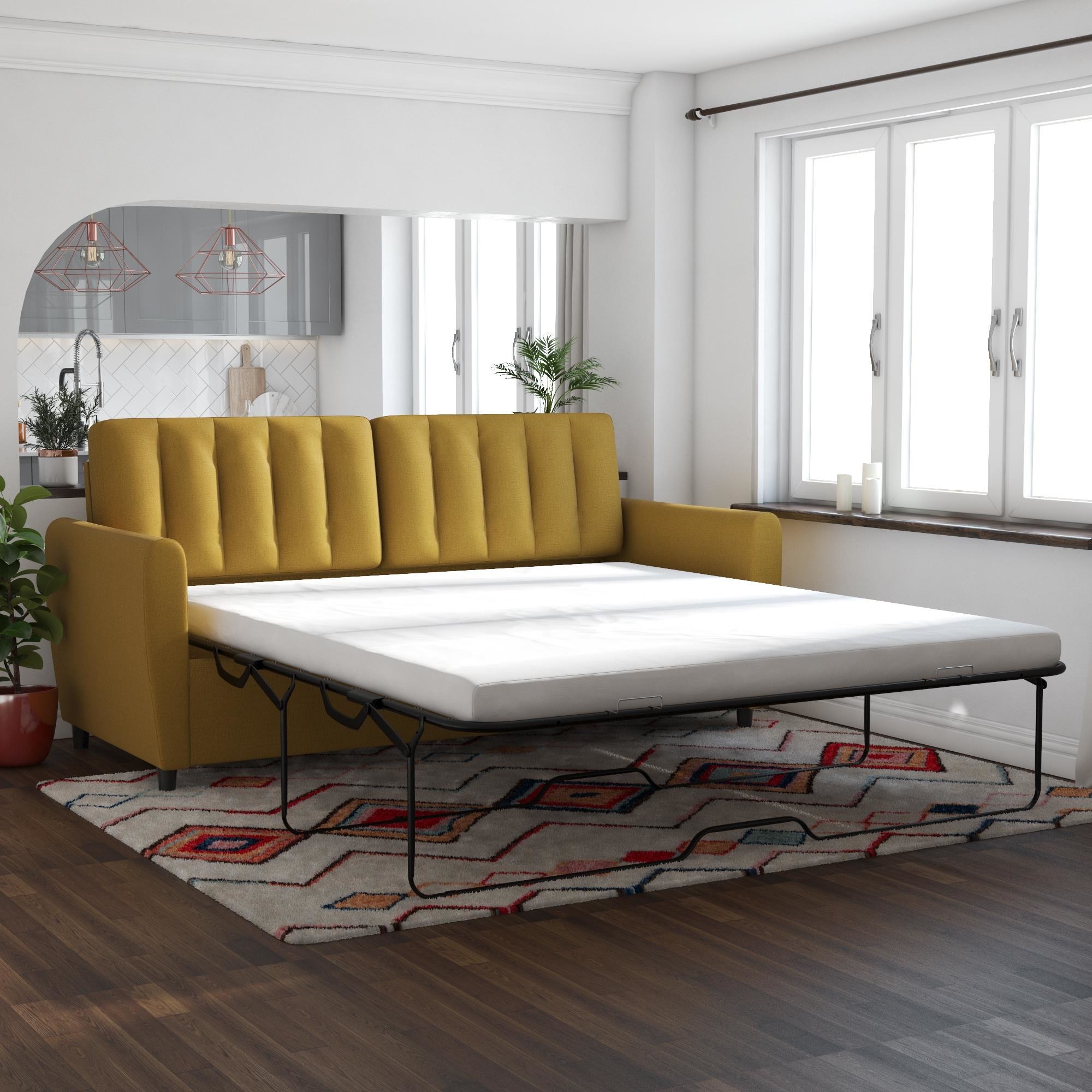 A mustard-colored sofa with a white mattress and black metal frame opened 