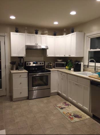 A reviewer's kitchen with outdated rounded knobs on their cabinets and drawers