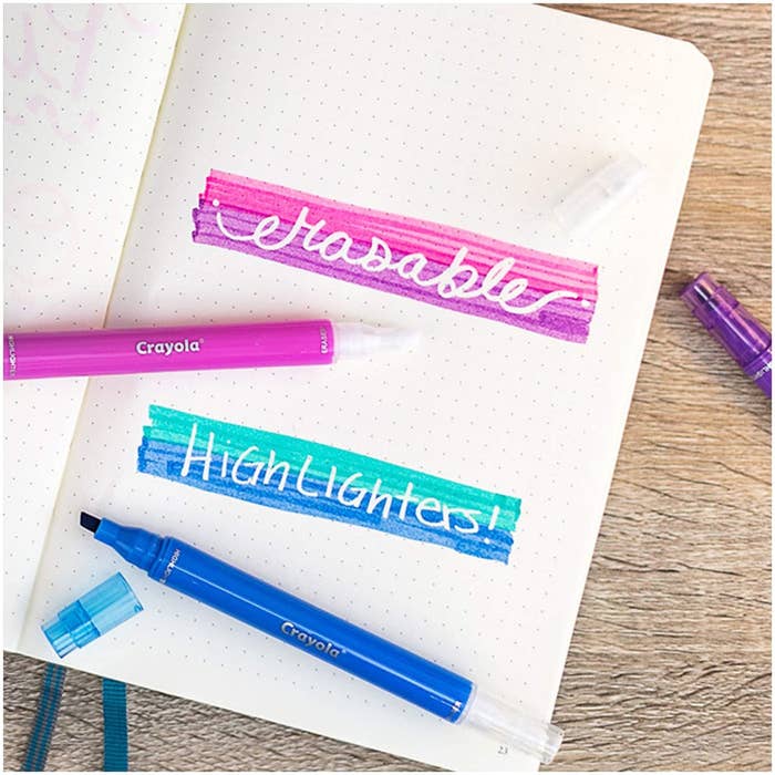 Two erasable highlighters on top of a bullet journal