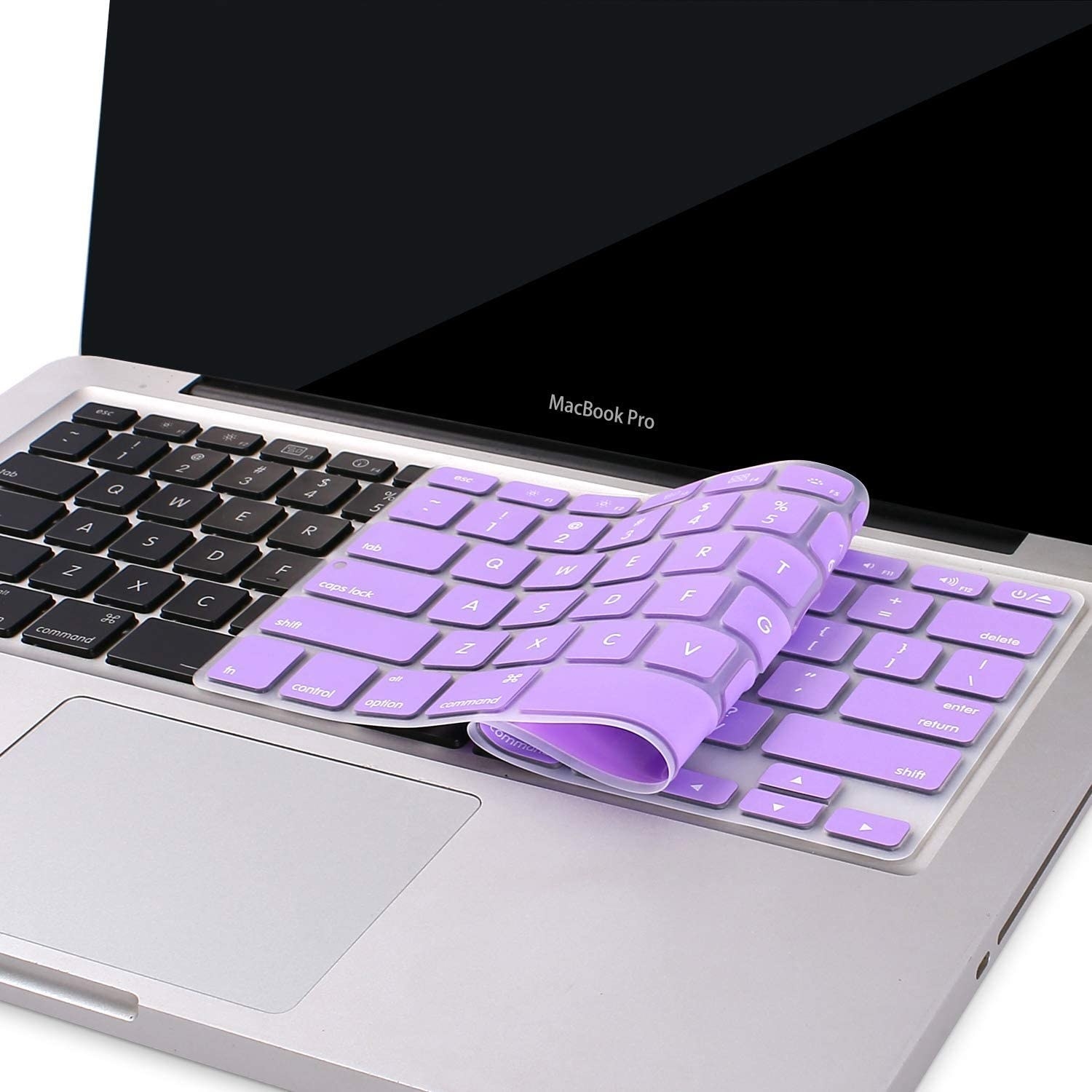 A pastel keyboard folded ontop of a laptop keyboard