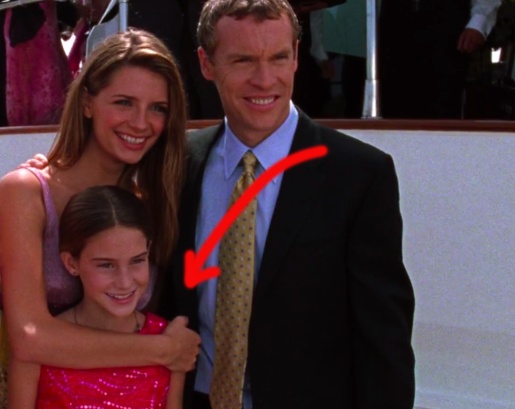 young Kaitlin posing with Marissa and their dad