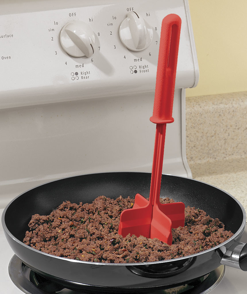 Product photo showing the ChopStir being used to break up ground beef cooking in a pan 
