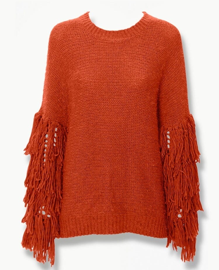 rust orange crewneck sweater with fringed sleeves starting at around the elbow and going to the wrist