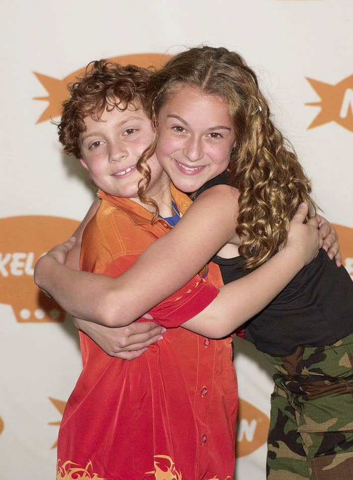 Daryl and Alexa hugging on a red carpet.