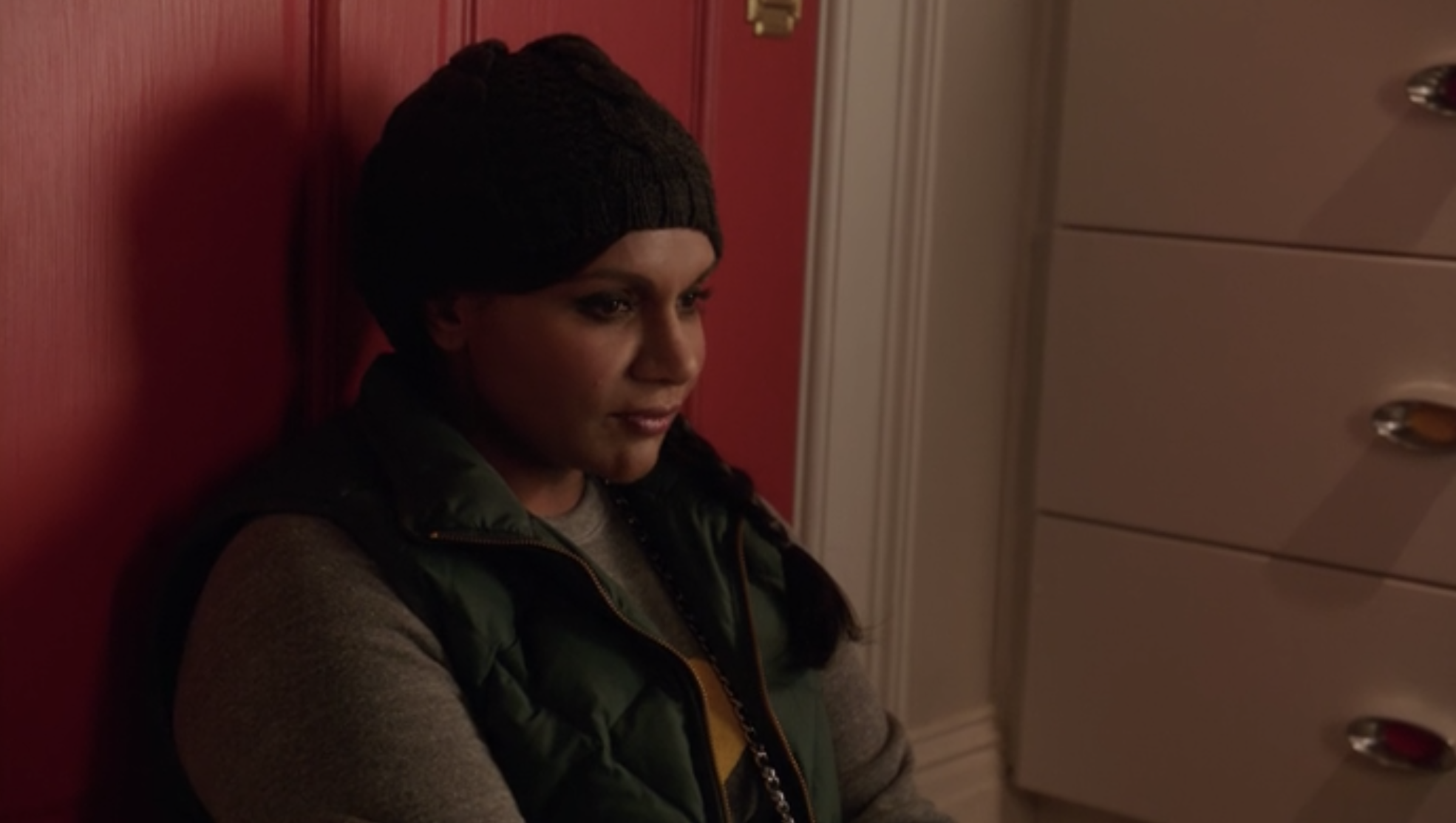 Mindy sitting on her closet floor as she contemplates leaving Danny.