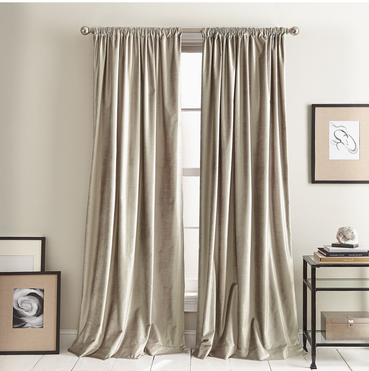 The velvet curtains in gold on a window in a room