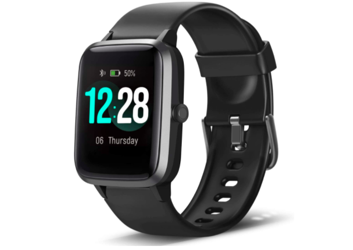 Black fitness tracker that says the time and date on the front with a black strap