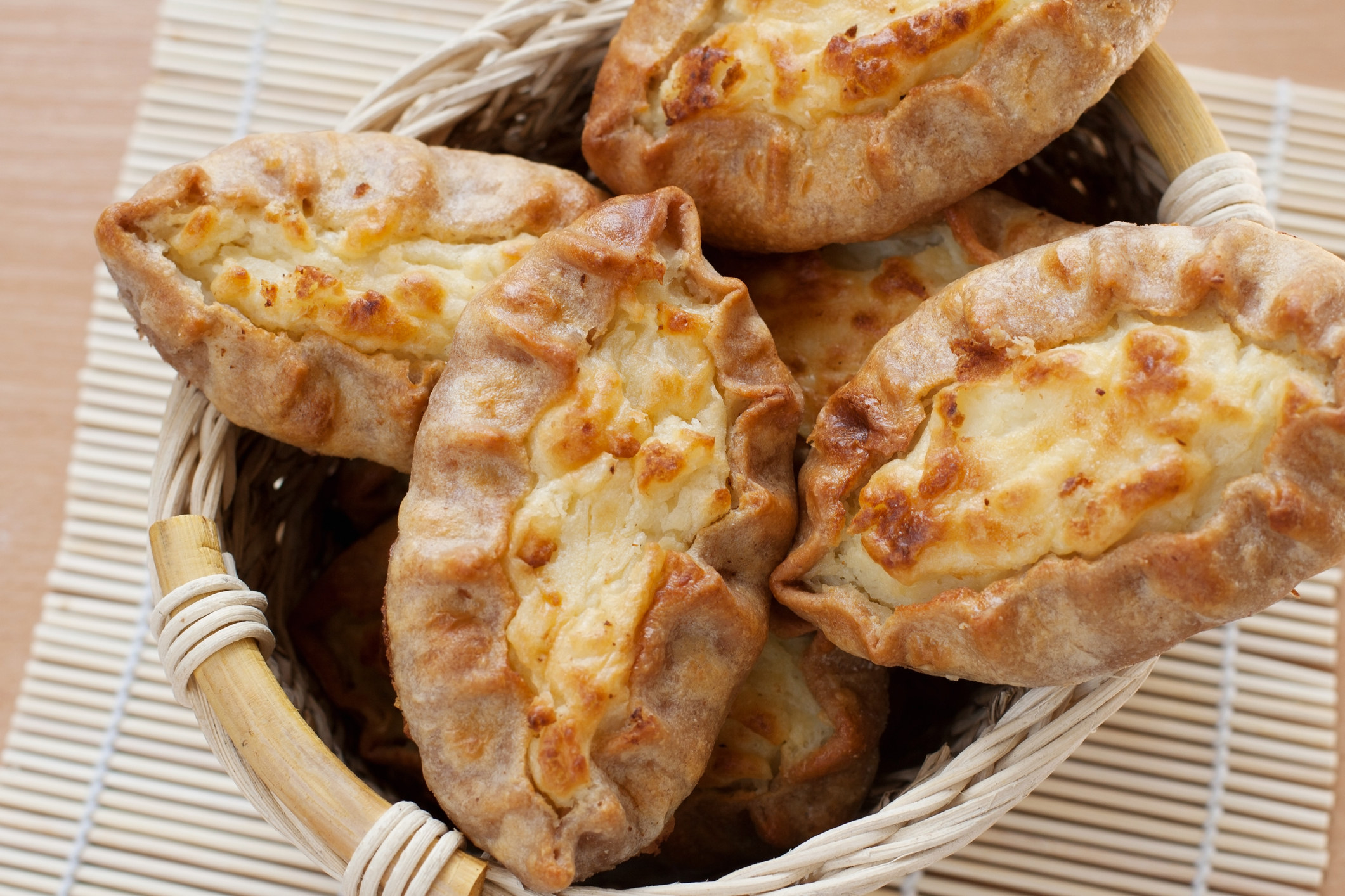 rustic-looking hand pies with a bread-like crust and a potato filling