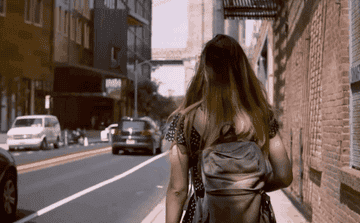 A woman walks around New York city exploring