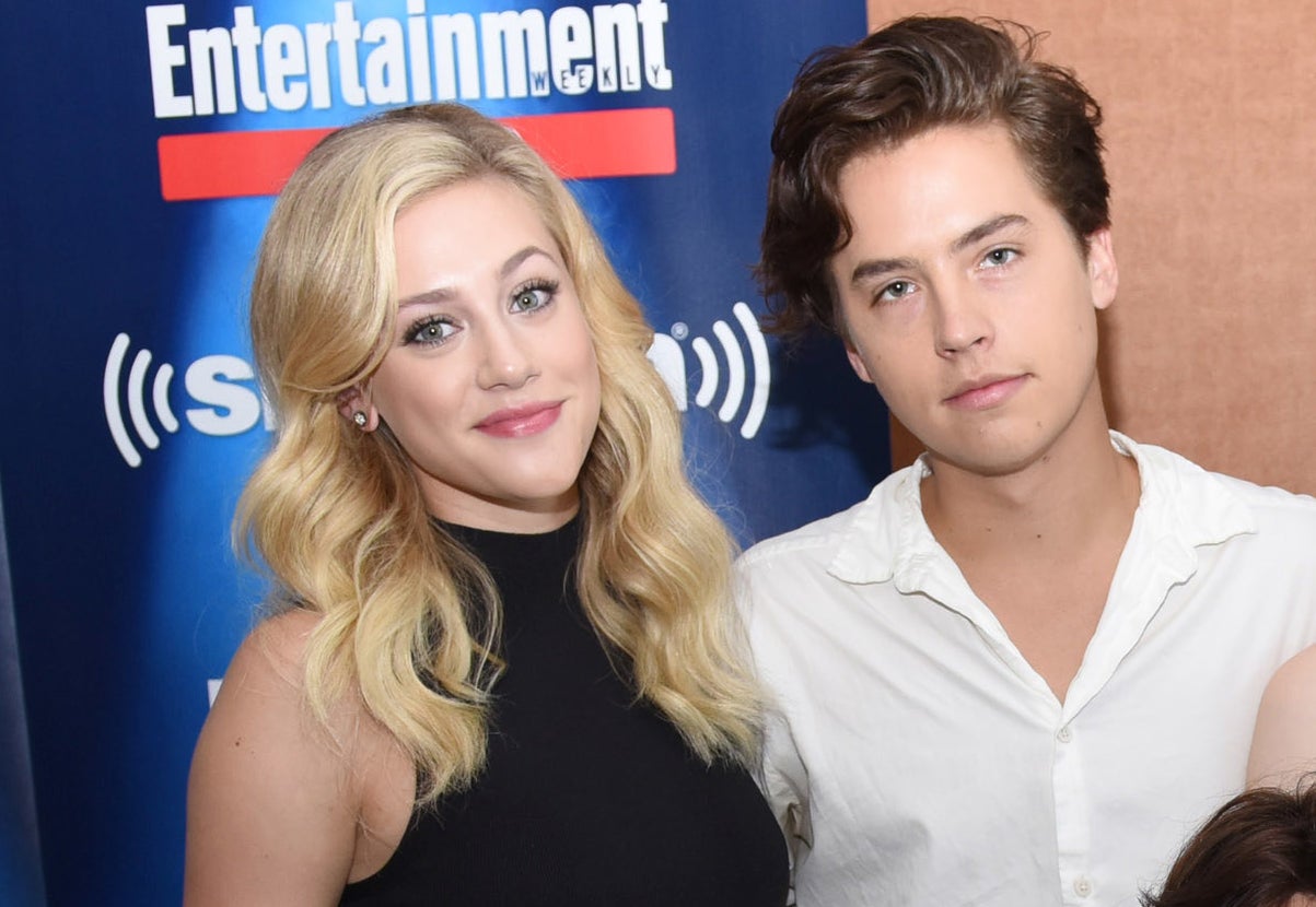 Lili Reinhart and Cole Sprouse pose together during a live cast interview