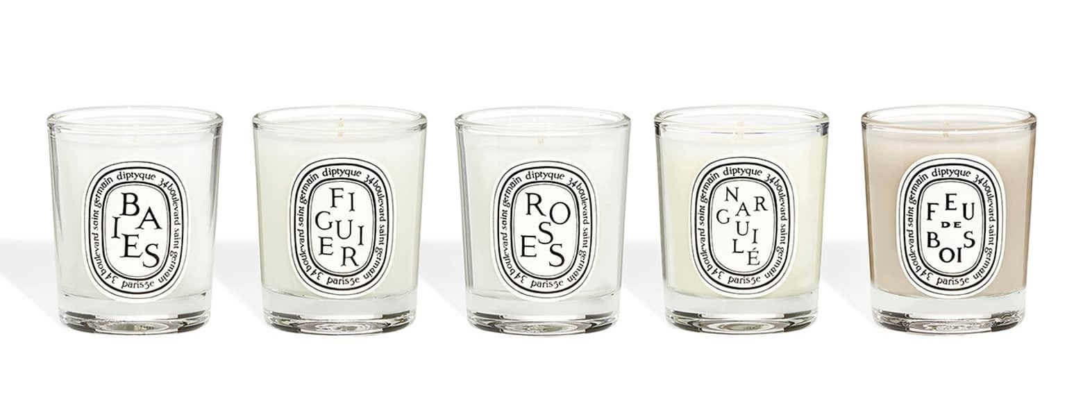 The set of five candles in a row with labels on the front that say what the scents are