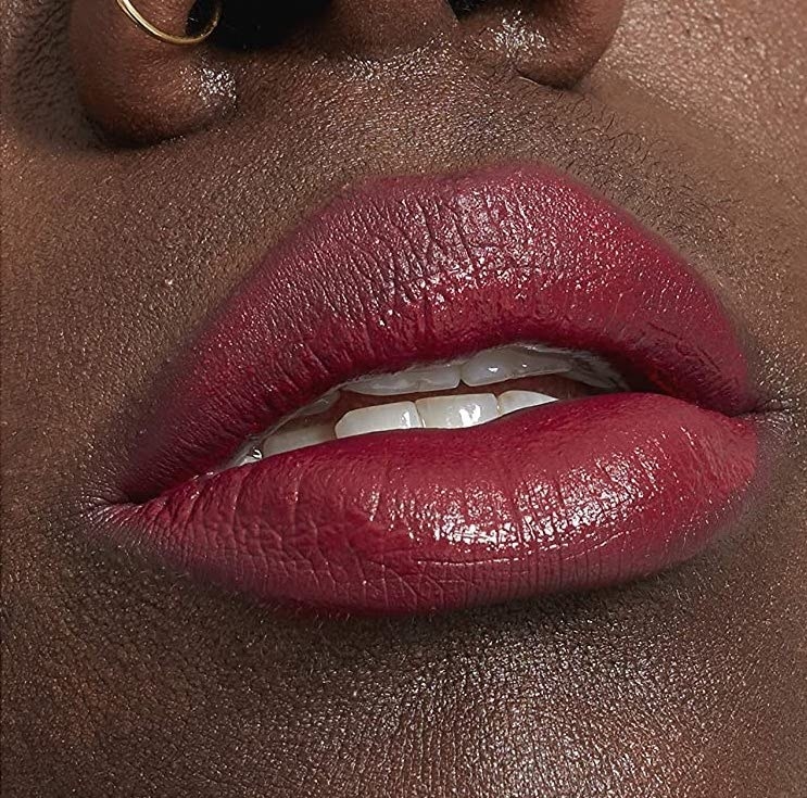 A close up of someone's parted lips wearing the diffused lip colour