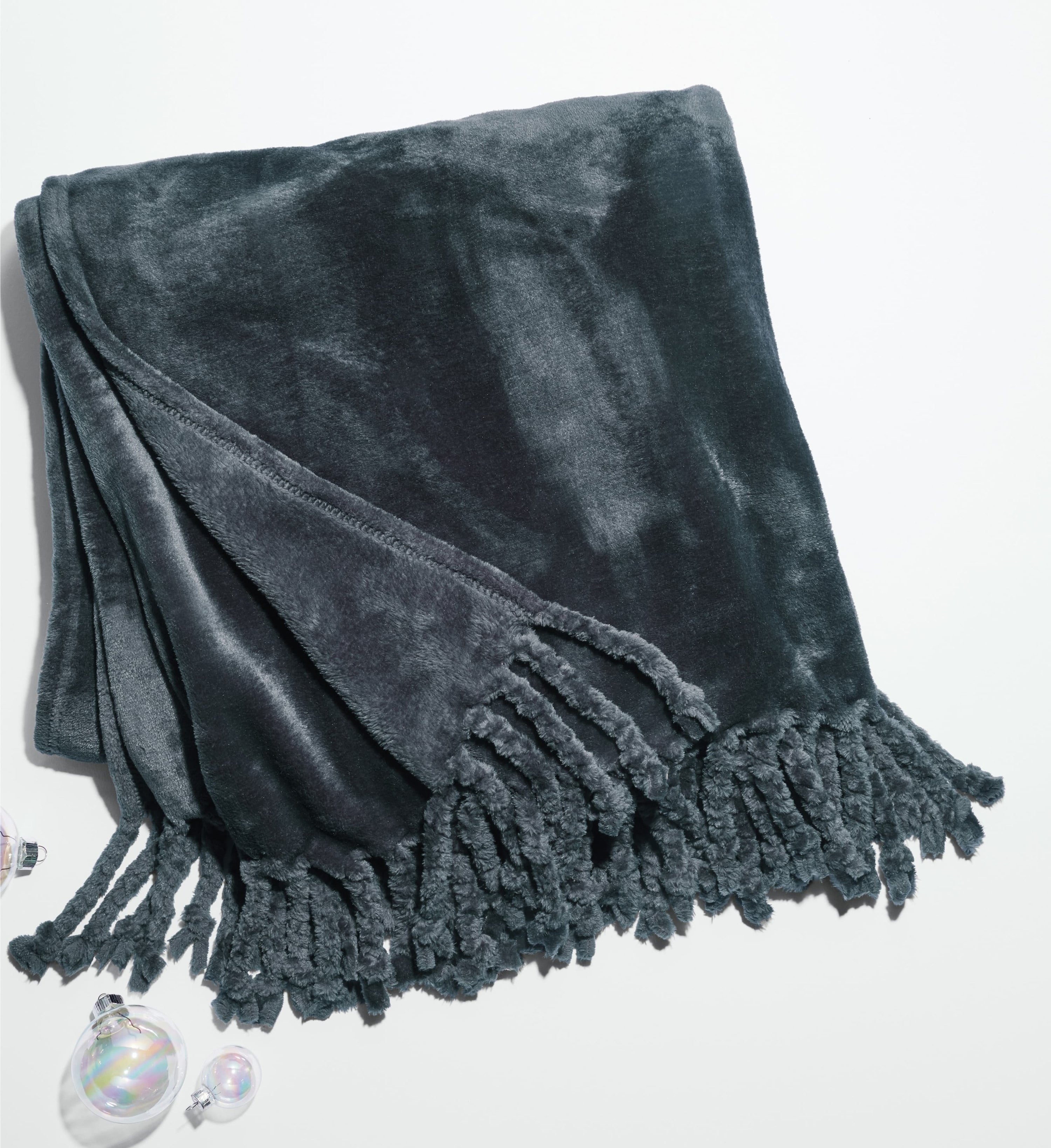 The blanket in dark teal blue