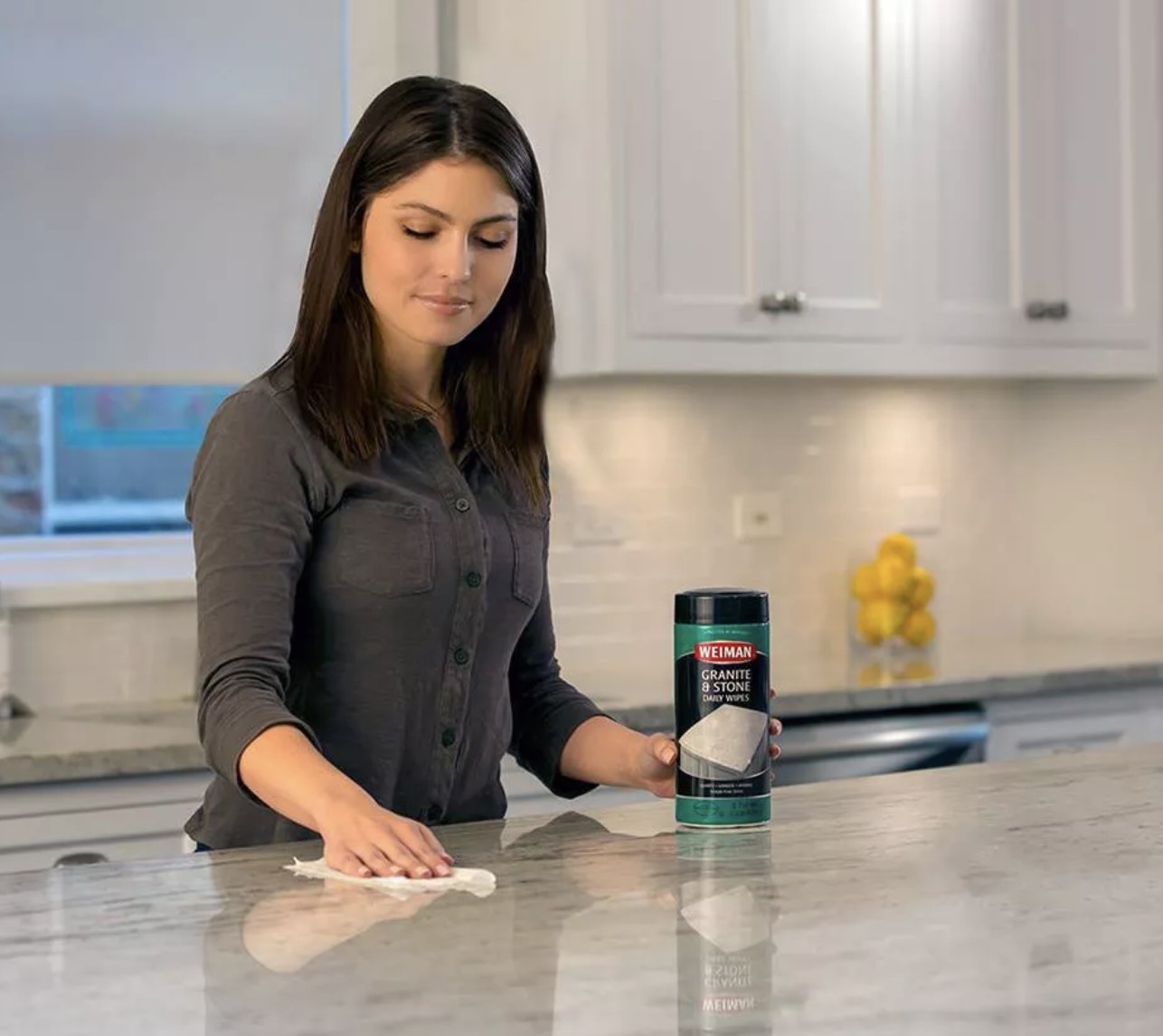 Woman uses wipes on counter