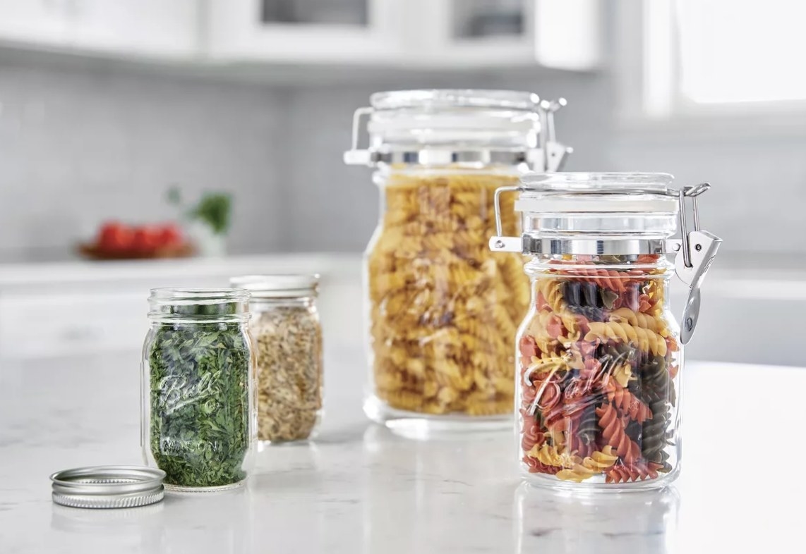 Mason jars store pasta and seasonings