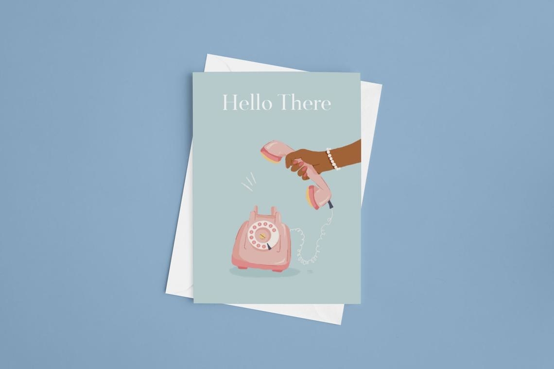 An eggshell blue card with a turn-dial phone being picked up by a hand with the words &quot;Hello There&quot; on the top