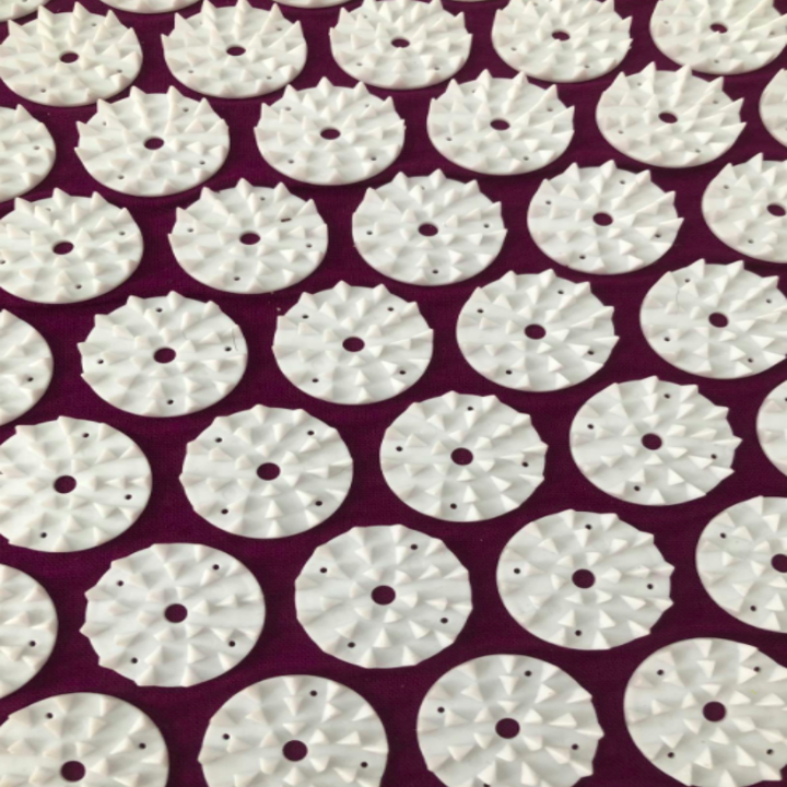 A close-up customer review photo of the needles on the Acupressure Mat and Pillow Massage Set.