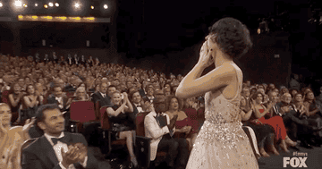 Phoebe Waller-Bridge blowing a kiss to the crowd while going on stage to get her Emmy Award