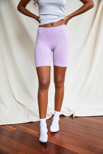 Model in purple shorts 