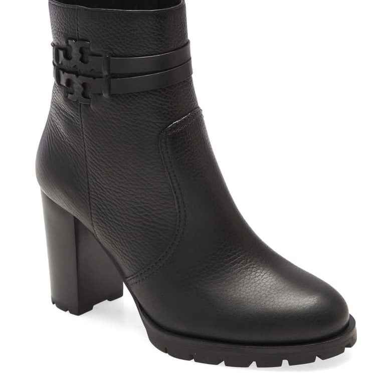 The heeled black booties with the iconic T-logo wrapped around the ankle