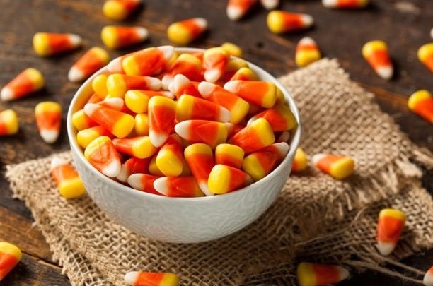 A bowl filled with colorful candy corn