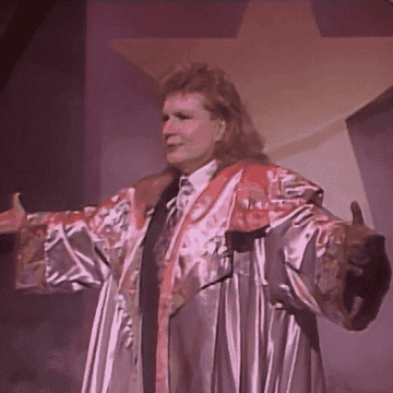 A gif of Walter Mercado being surrounded by a cloud of smoke.