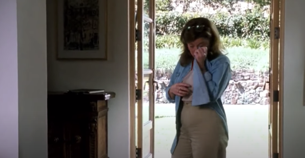 Chessy wiping away her tears with her iconic jean shirt