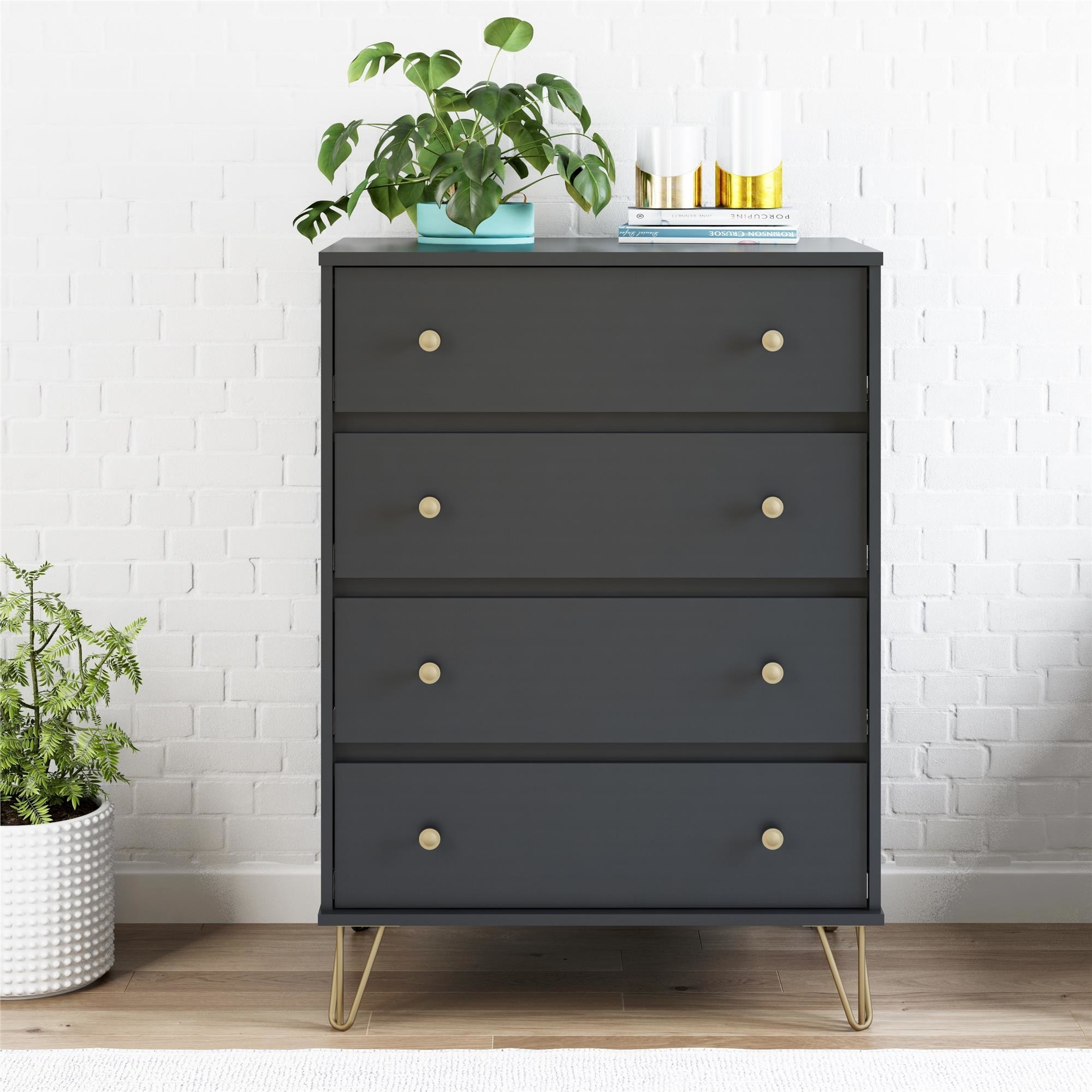 a black standing dresser with four drawers