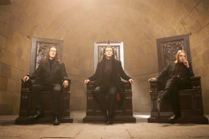 The leaders of the Volturi sitting in their italian-style thrones
