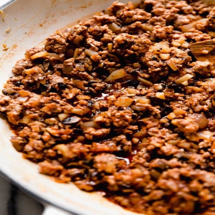 A bowl of Chinese pork and mushroom filling.