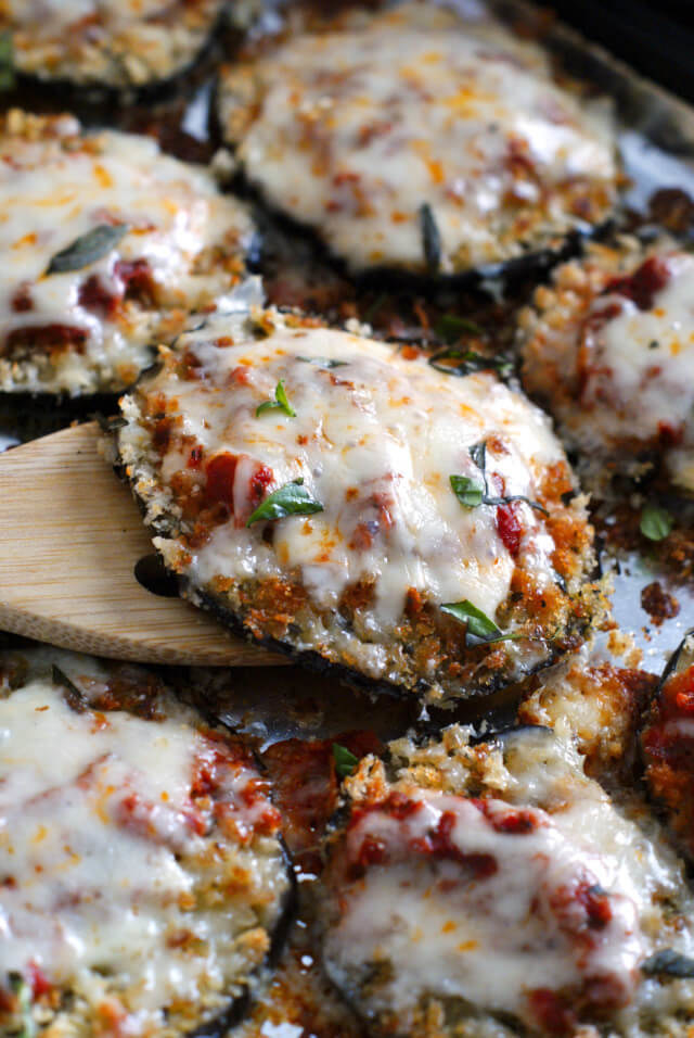 Sliced of eggplant coated in panko and topped with marinara sauce and mozzarella cheese.