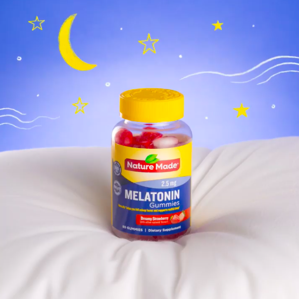 strawberry melatonin gummies on a pillow
