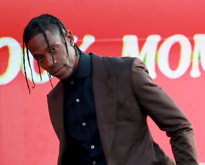 Travis Scott wearing a suit at a Hollywood event