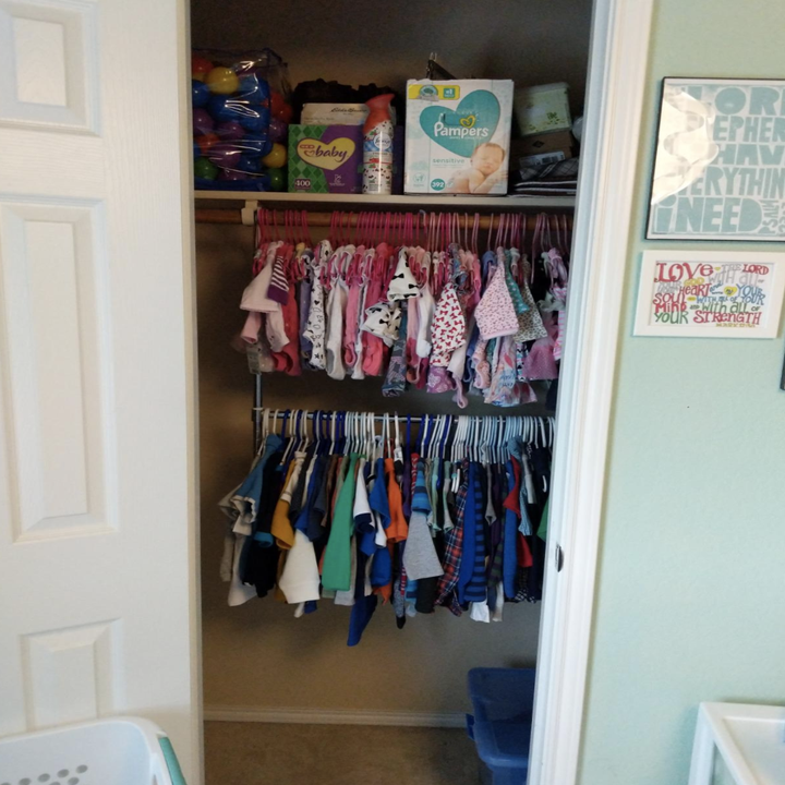 Same closet with hanging rod installed below, so there are now two rods for clothing