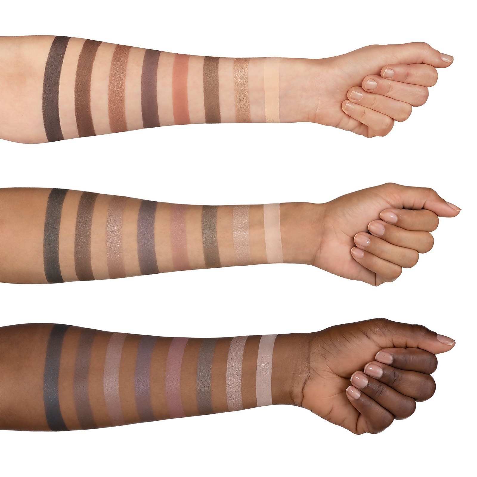 Three different skin-toned arms showing the different colors of the eyeshadow 