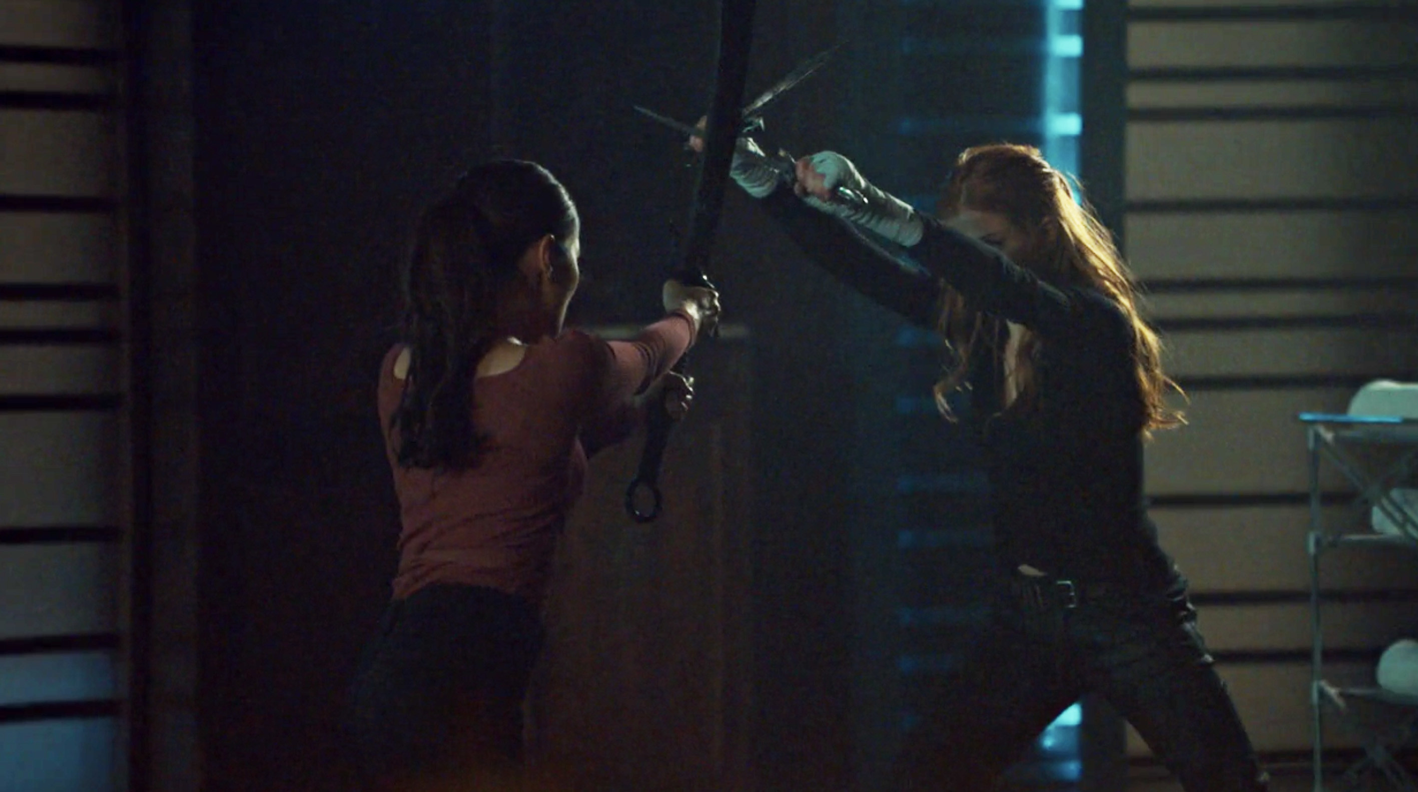 Clary and Aline fighting with swords