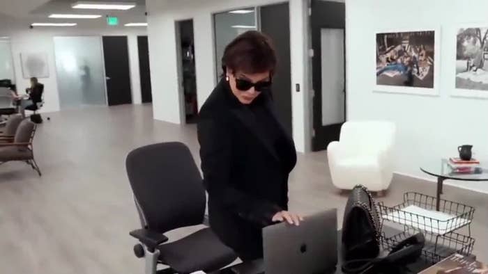 Kris Jenner look at the screen of a laptop. 
