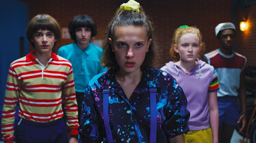 Stranger Things still: Will, Mike, Eleven, Max and Lucas stand together