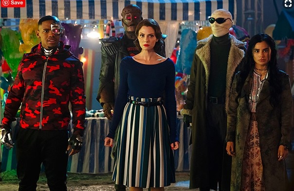 Still from Doom Patrol: The Doom Patrol, a group of superheroes, stand together at a carnival